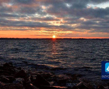 Wschód słońca nad jeziorem Niegocin - Spektakularny wschód słońca nad jeziorem Niegocin w Giżycku, idealne miejsce na poranną fotografię.